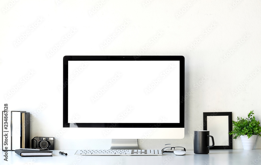 Fototapeta premium Office desk Work space stuff with notepad, laptop and coffee cup mouse notepad shot.