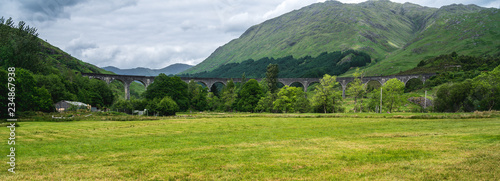 Glenfinnan Viaduct, tourist attraction featured in popular film about young wizard, Scotland, UK