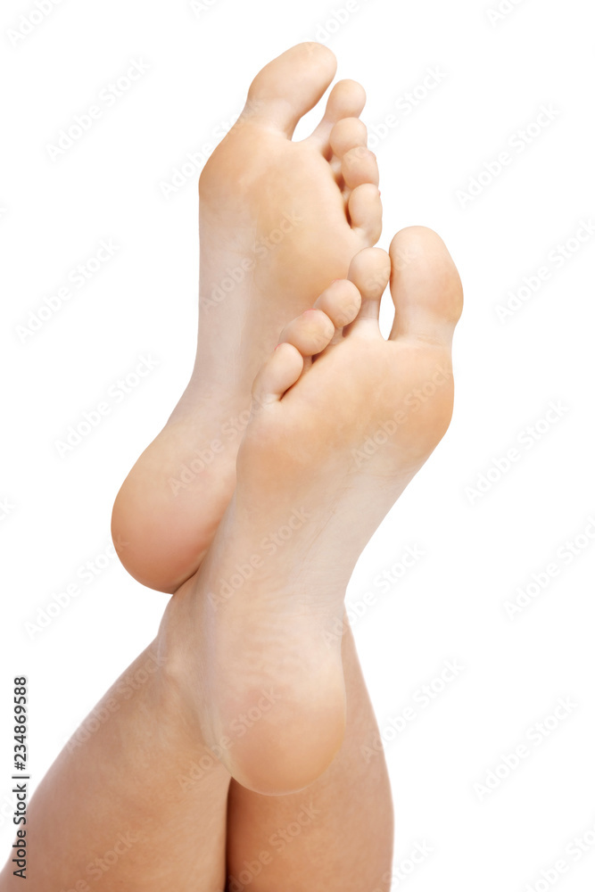 Closeup shot of female feet, isolated on white background Closeup shot of female feet, isolated on white background