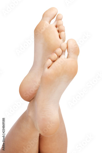 Closeup shot of female feet, isolated on white background © Nobilior