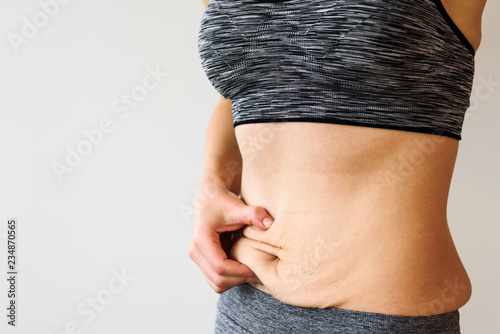 Woman belly after dieting photo