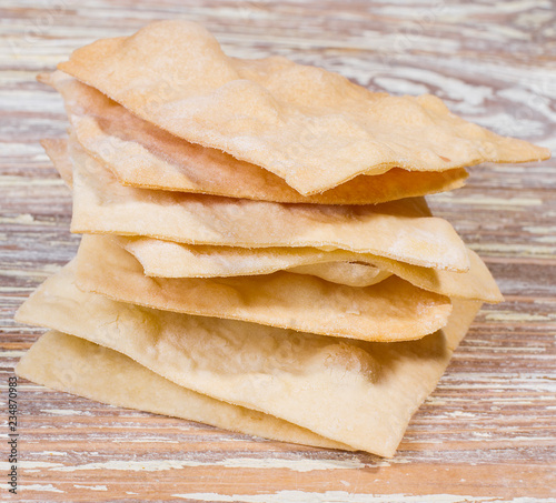 homemade chips on wooden background