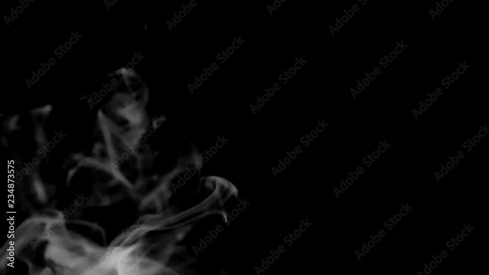 A slow motion smoke effect on a black background A slow motion smoke effect on a black background