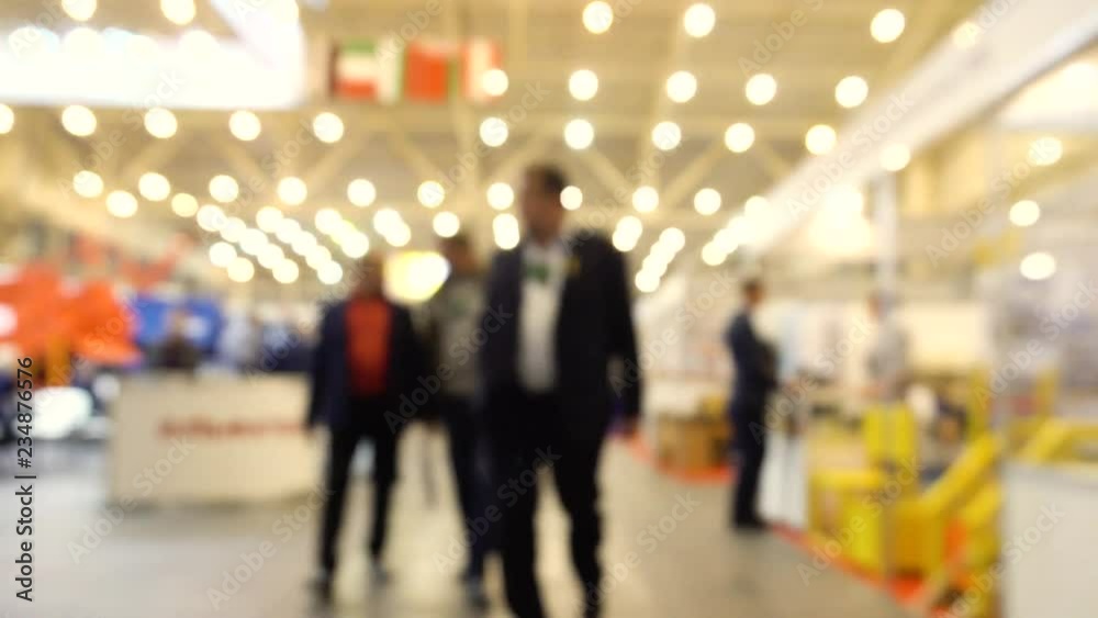Abstract Defocused Blurred Background flow of many people inside space shopping center or mall, exhibition, exposition, hall real time. Abstract Defocused Blurred Background flow of many people inside space shopping center or mall, exhibition, exposition, hall real time.