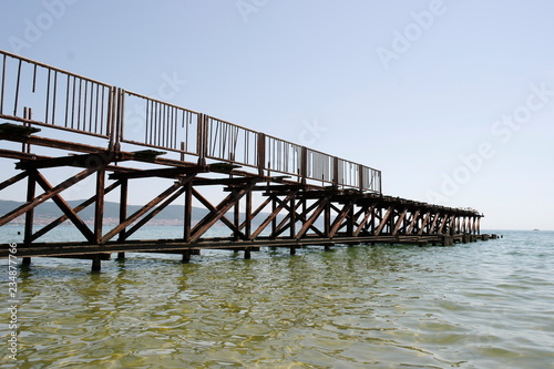 Old wooden pier with metal fences