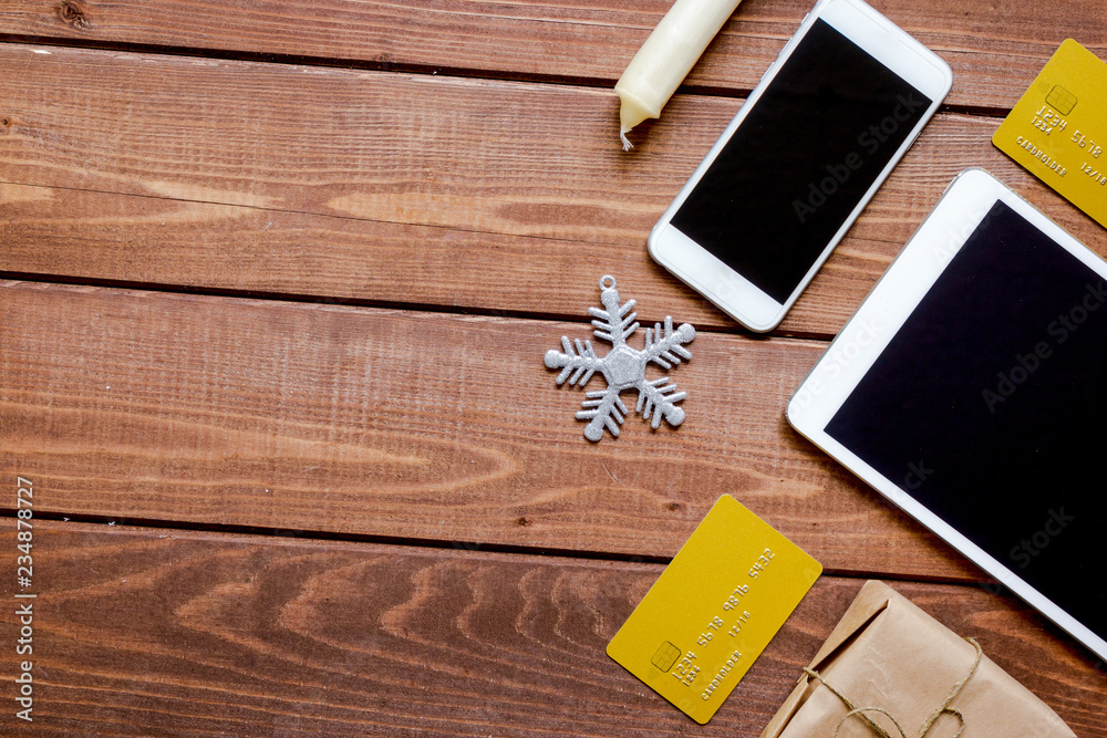 smartphone, tablet, shopping for new year online wooden table smartphone, tablet, shopping for new year online wooden table