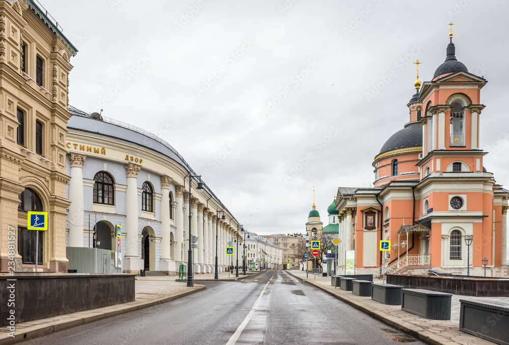 Varvarinskaya Church and Varvarka Street in the spring cloudy morning.. Moscow, Russia.
