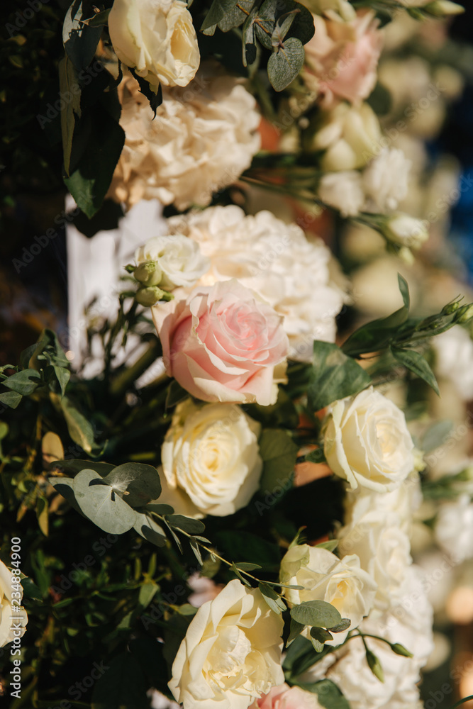 Floral decoration on the wedding ceremony by the restaurant. Pink and white color of rose. Elegant decor on charming wedding Floral decoration on the wedding ceremony by the restaurant. Pink and white color of rose. Elegant decor on charming wedding