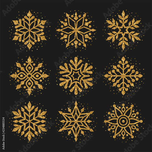 Snowflakes collection. Vector illustration of golden shining snowflakes. Isolated on the black background