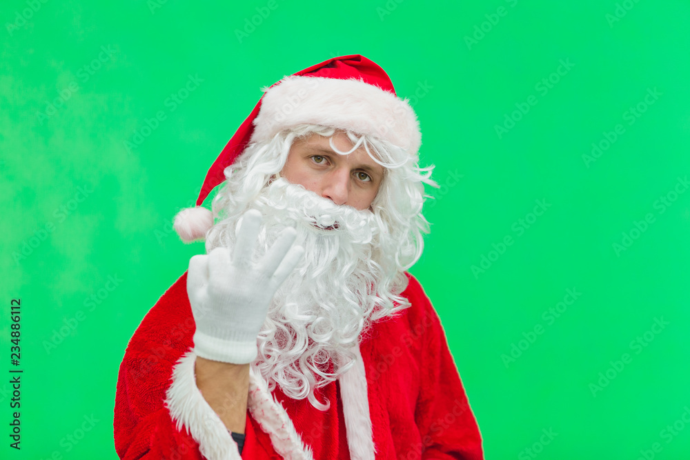 Naklejka premium Santa Claus showing three finger. chromakey. close up