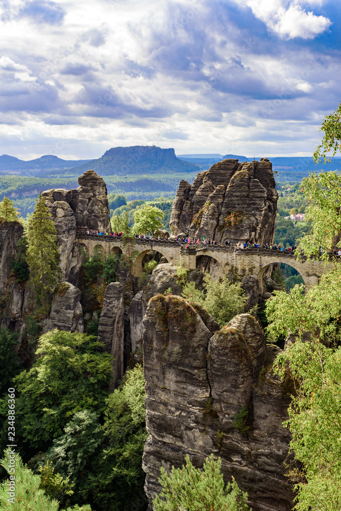 Panorama view on the Bastei bridge. Bastei is famous for the beautiful rock formation in Saxon Switzerland National Park, near Dresden and Rathen - Germany. Popular travel destination in Saxony.