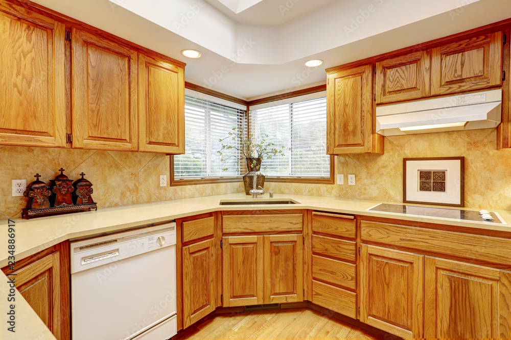 Open kitchen interior with dark wood cebinets and wood floor Open kitchen interior with dark wood cebinets and wood floor