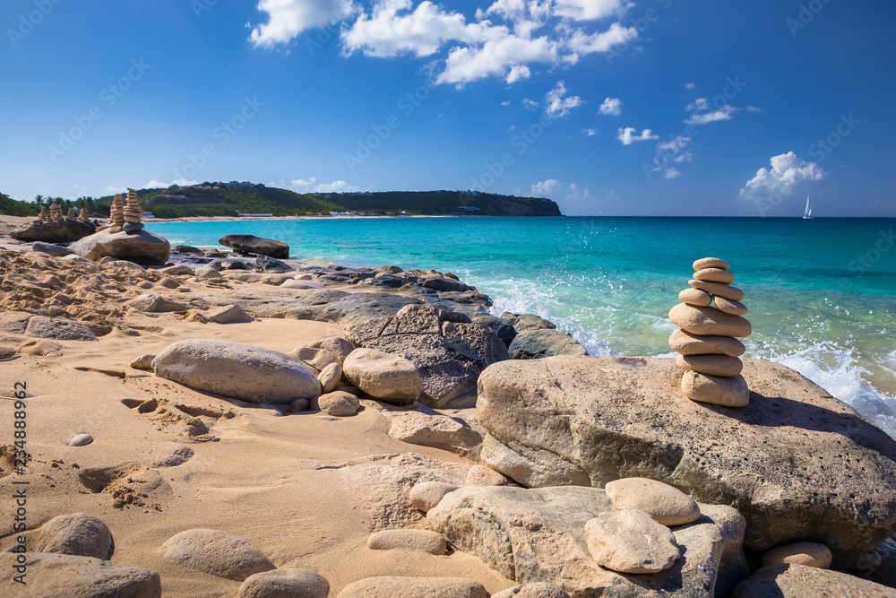 Stacks of stones in balance at a beach Stacks of stones in balance at a beach