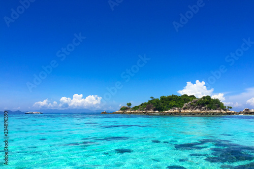 sea view at Koh Lipe Beach Thailand with clear water and blue sky. visible noise due to high ISO.