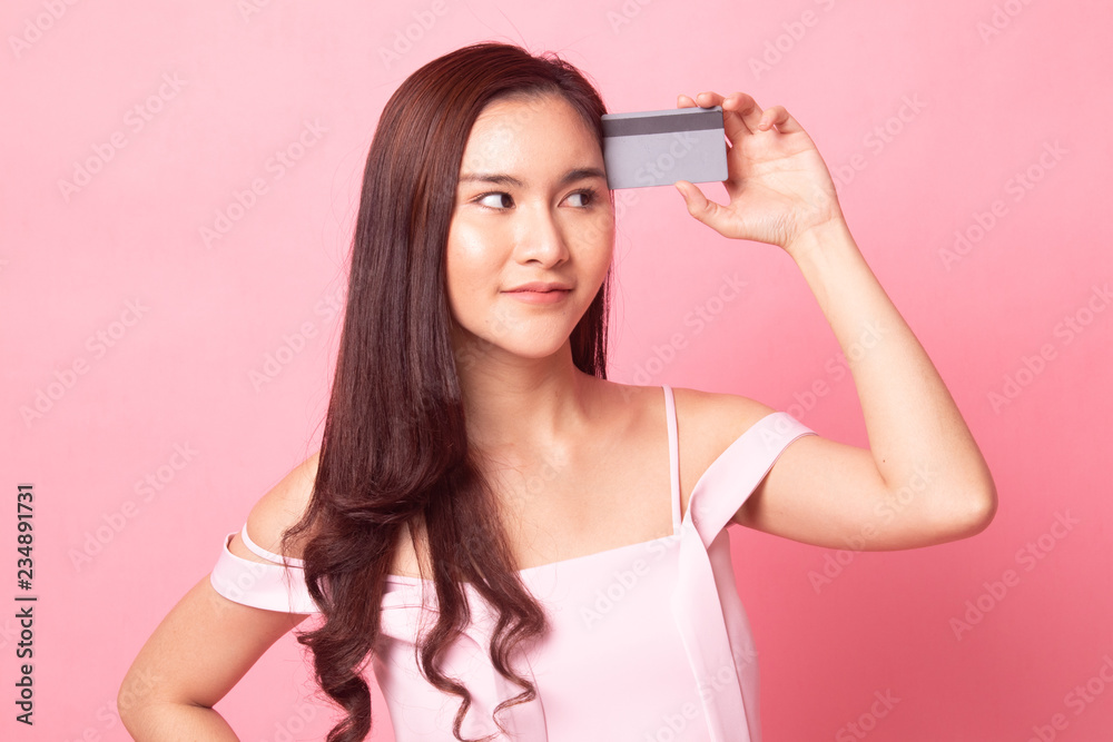 Young Asian woman headache with a blank card. Young Asian woman headache with a blank card.
