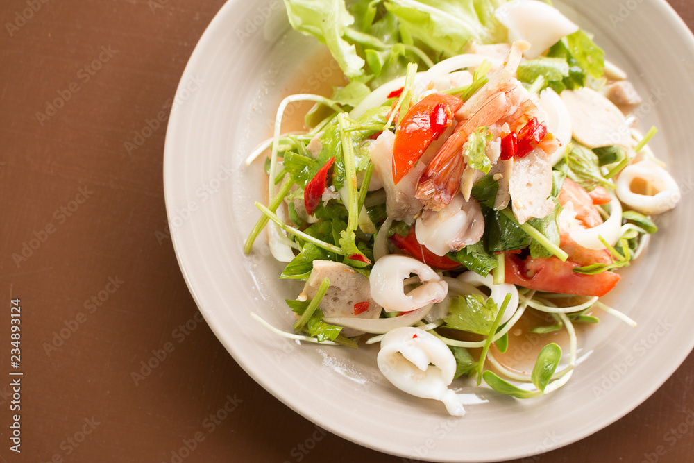Thai Spicy salad with cuttlefish., shrimp, fish and vegetable Thai Spicy salad with cuttlefish., shrimp, fish and vegetable