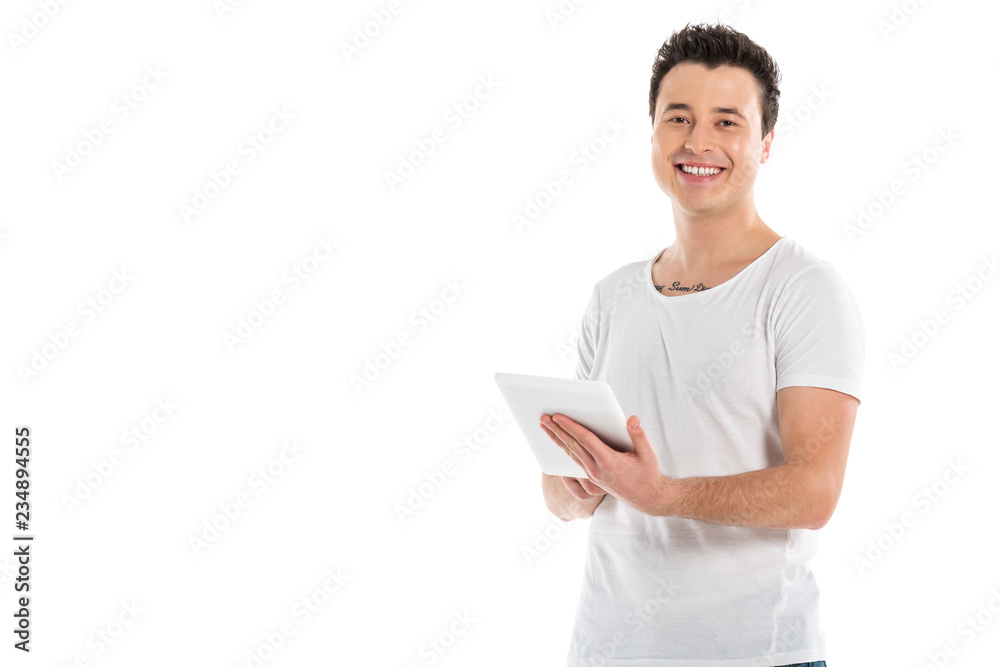 handsome man using digital tablet and looking at camera isolated on white handsome man using digital tablet and looking at camera isolated on white