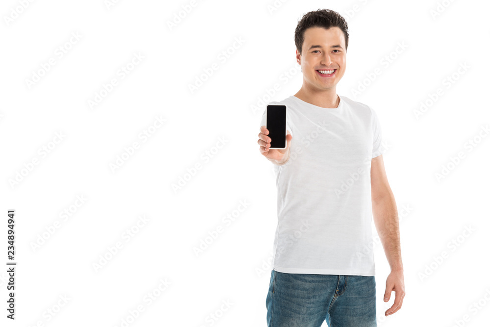 handsome man presenting smartphone with blank screen and looking at camera isolated on white handsome man presenting smartphone with blank screen and looking at camera isolated on white