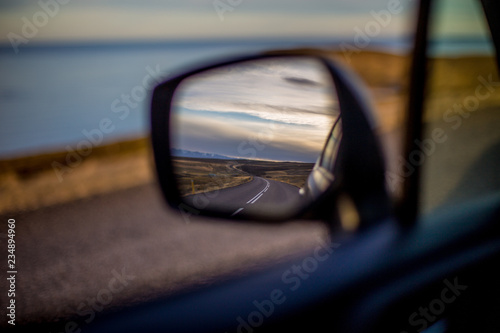 Iceland road in rear view mirror