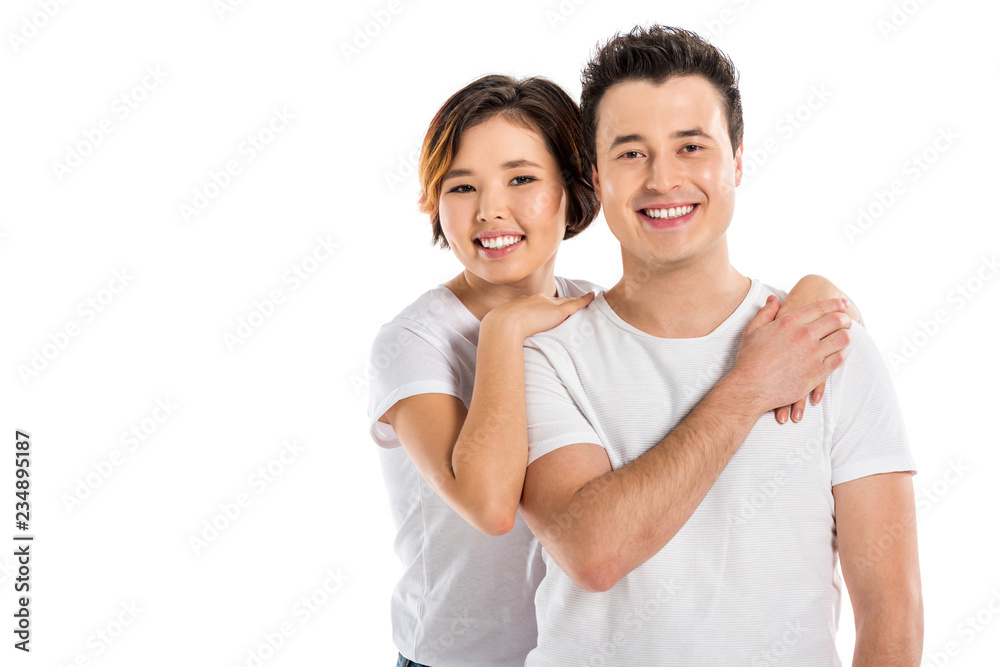 smiling portrait of young loving couple hugging and looking at camera isolated on white smiling portrait of young loving couple hugging and looking at camera isolated on white