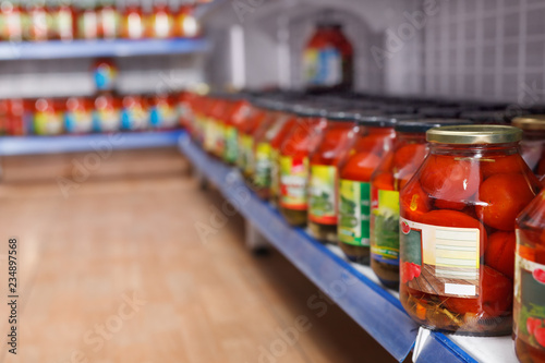 Wallpaper Mural Different pickle goods at shelves in food store Torontodigital.ca