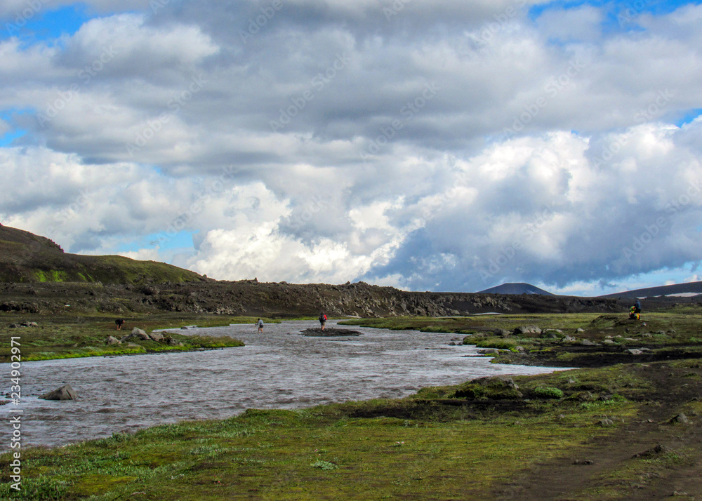 View on the wide river running from Myrdalsjokull glacier surrounded by scenic landscape, Laugavegur Trail, highlands of Iceland