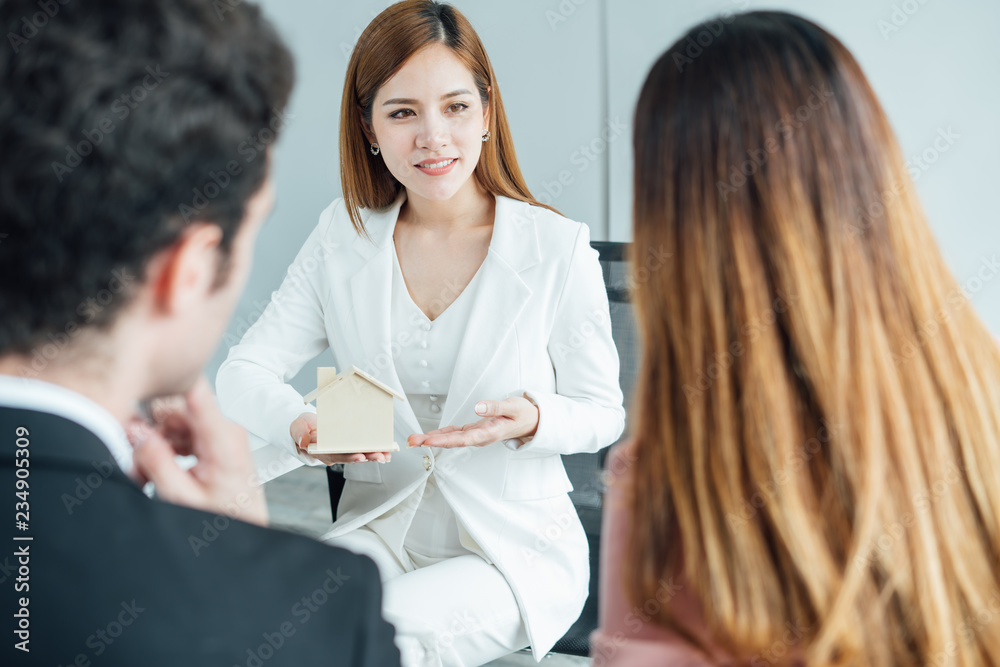 Home sale representative present good house and customer calculate about mortgage loan financial for make decision.Real estate agent to present the property. Home sale representative present good house and customer calculate about mortgage loan financial for make decision.Real estate agent to present the property.