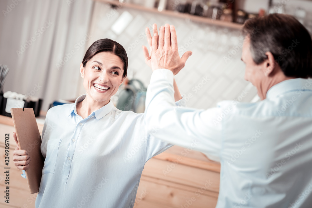 Obraz premium Happy nice people giving each other high five