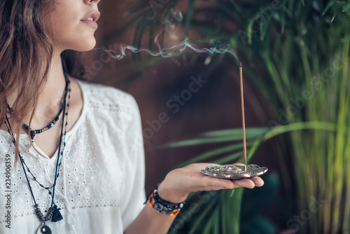 Incense Stick. Caucasian Woman Enjoying Aroma Stick photo