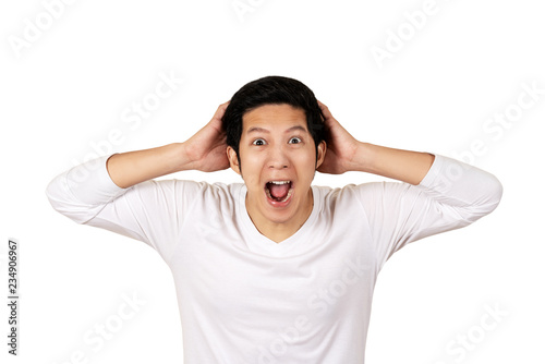 Young attractive asian man in casual white shirt looking at camera with feeling amazed, excited or shocked face with open mouth on isolated background. Portrait of funny male face expression concept.
