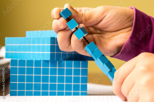 Photography Child learns math volume and capacity