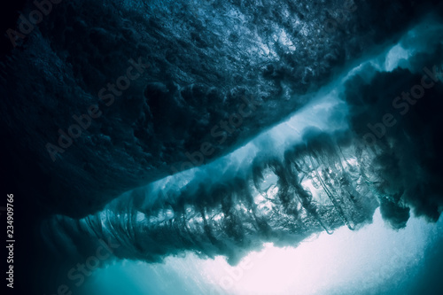 Underwater wave. Blue barrel wave crashing in ocean.