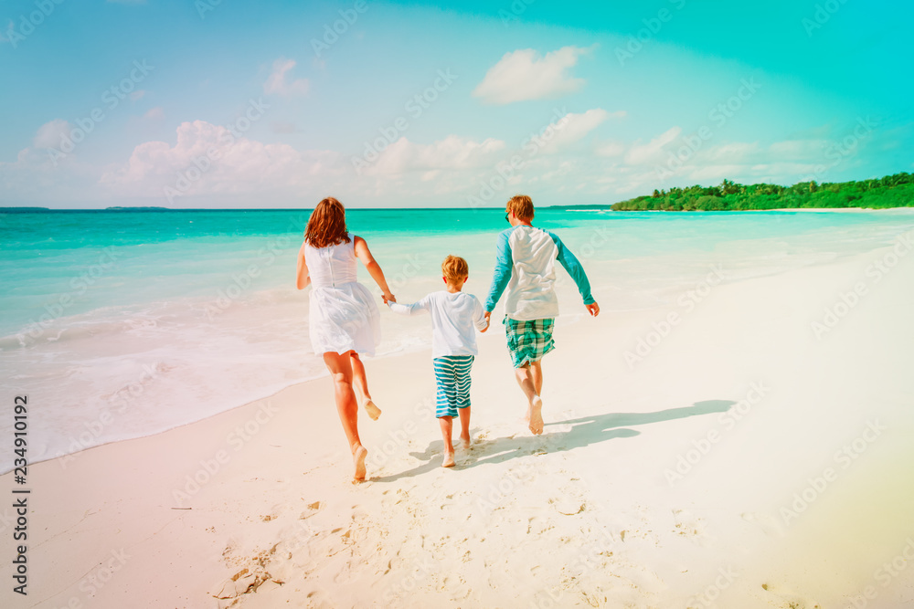 happy family with child enjoy tropical beach