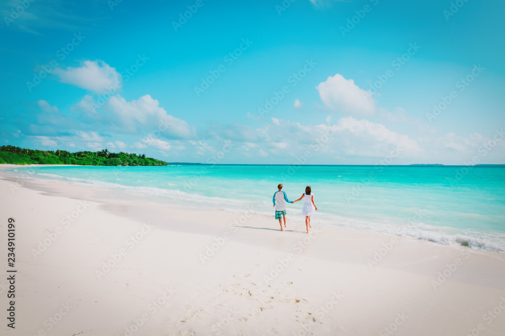 happy loving couple run enjoy tropical beach