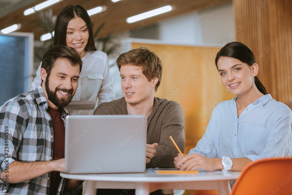 Charming four colleagues developing business strategy Charming four colleagues developing business strategy