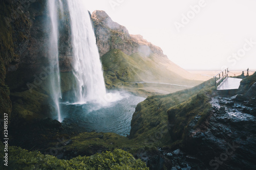 Perfect view of famous powerful Seljalandsfoss waterfall in sunlight. Location place Iceland, sightseeing Europe.