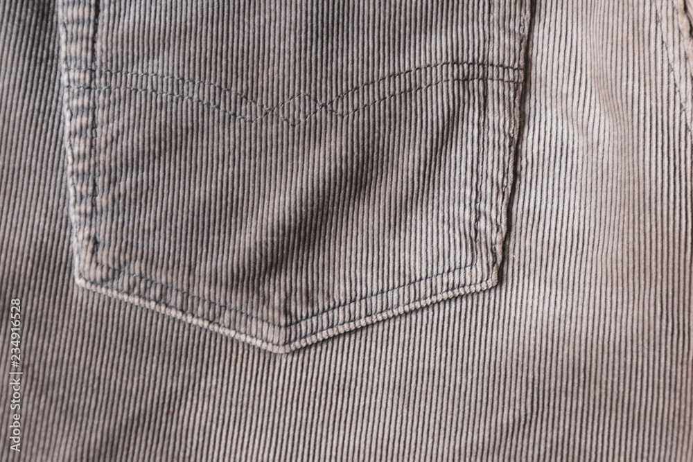 pocket on grey ribbed corduroy jeans. velvet fabric texture Stock Photo ...