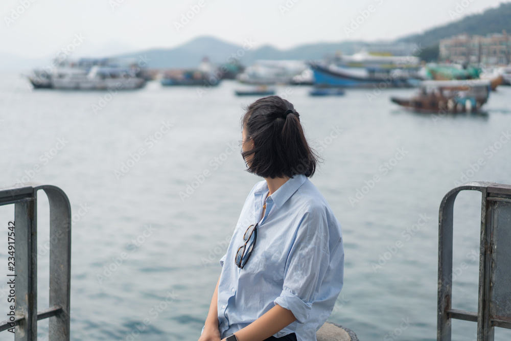 Young Asian woman travel at the beach in Hong Kong