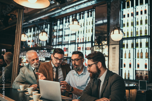 Businessmen working together at the pub