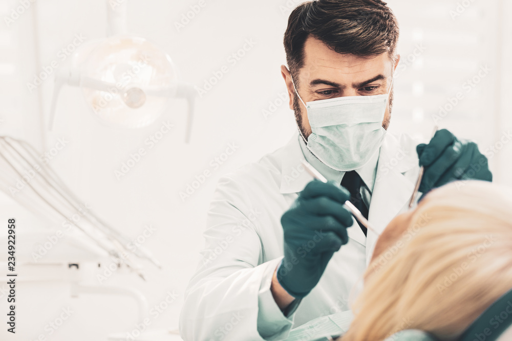 Dentist working with clients teeth Dentist working with clients teeth