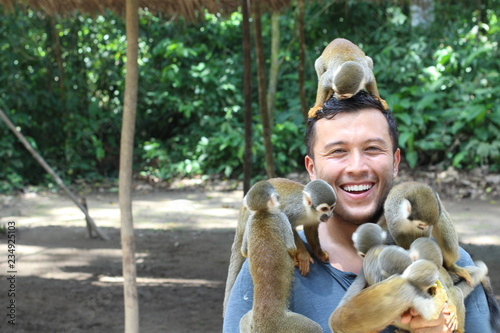 Beautiful monkeys interacting with a human