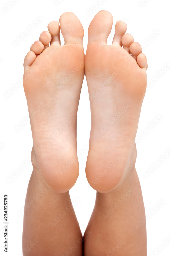 © Nobilior - Closeup shot of female feet, isolated on white background