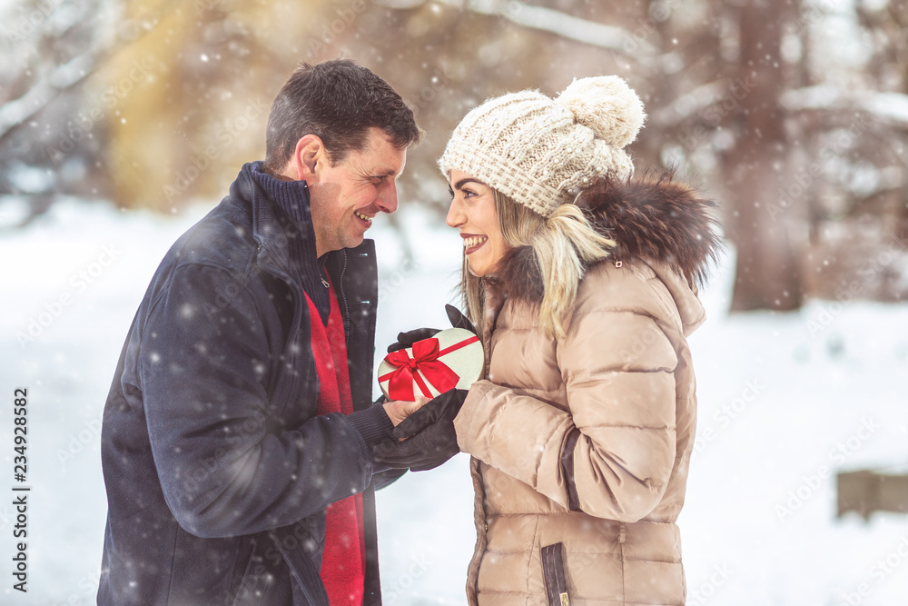 Merry Christmas. Happy couple celebrating Christmas.