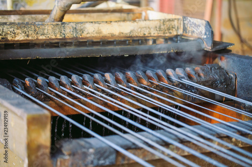 Steel wire metal feeding into bending machine in the industrial factory