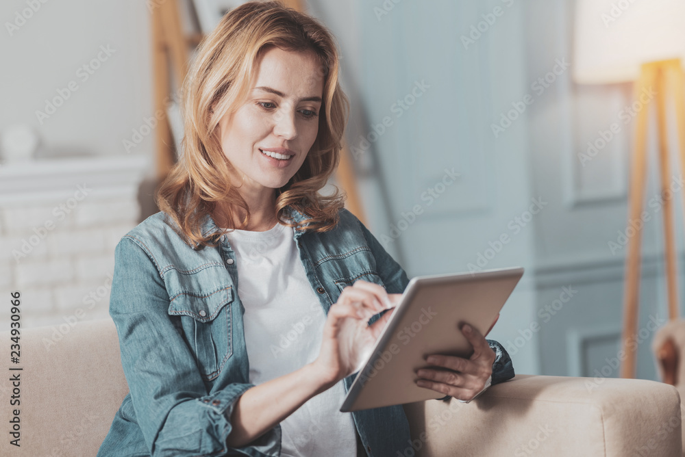 Joyful attractive woman surfing the internet Joyful attractive woman surfing the internet