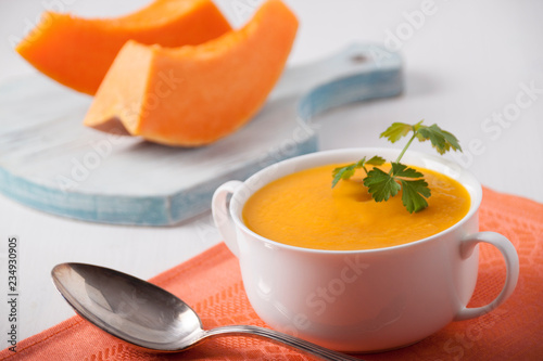 Pumpkin cream soup in a white plate