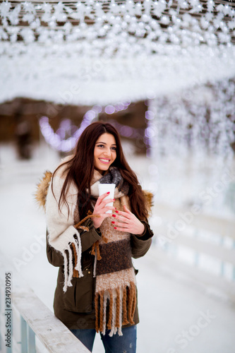 Young woman in a snow park ...