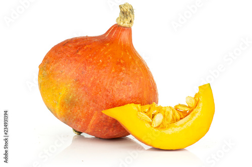 Group of one whole one slice of fresh red kuri pumpkin hokkaido variety isolated on white background