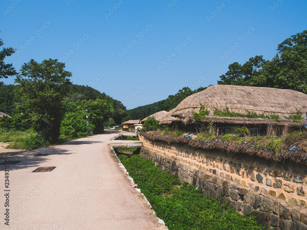 The small street with thatched houses in the traditional asian village in South Korea