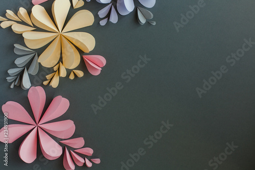 Handmade origami heart shaped paper flowers. Valentine's day or celebration background.